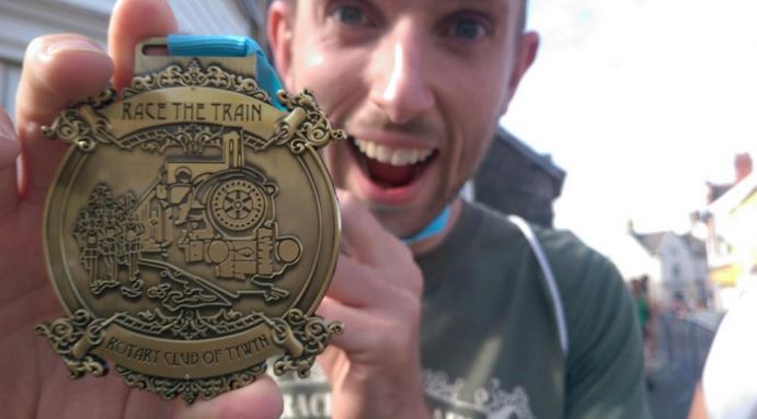 Guy with his finisher's medal